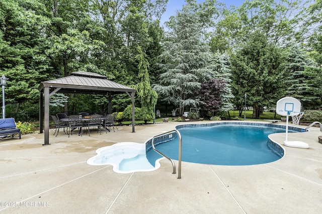 1020 Aumack Rd, Jackson, NJ 08527 - swimming pool featuring a patio, a gazebo, view of wooded area, and outdoor dining space