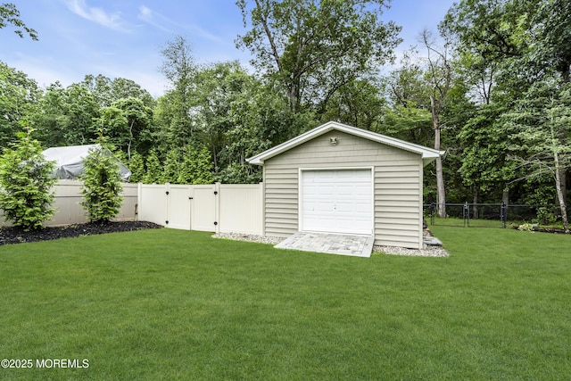 1020 Aumack Rd, Jackson, NJ 08527 - fenced backyard featuring a gate, an outdoor structure, and a detached garage
