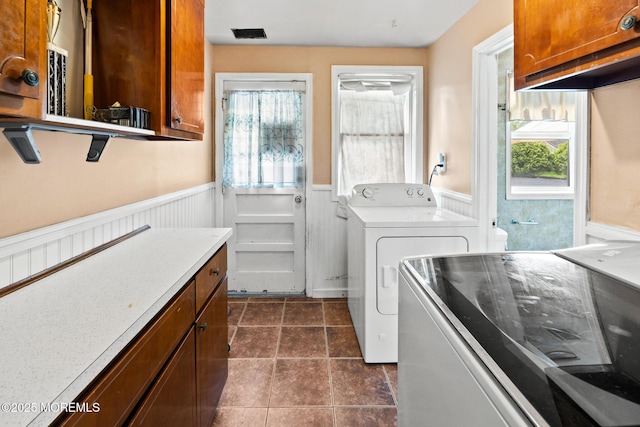 117 Greymoor Rd, Howell, NJ 07731 - laundry room featuring wainscoting, separate washer and dryer, cabinet space, and dark tile patterned flooring