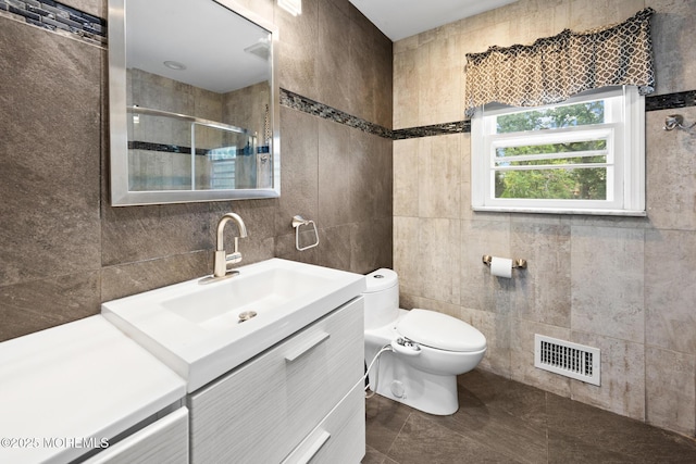 117 Greymoor Rd, Howell, NJ 07731 - full bath featuring tile walls, vanity, a stall shower, and tile patterned flooring