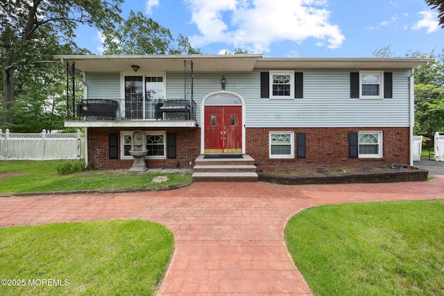 117 Greymoor Rd, Howell, NJ 07731 - raised ranch featuring a balcony and brick siding
