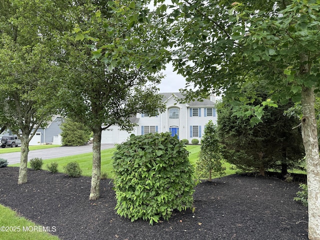 6 Eagle Ridge Ln, West Creek, NJ 08092 - view of front of house featuring a front lawn, asphalt driveway, and a garage