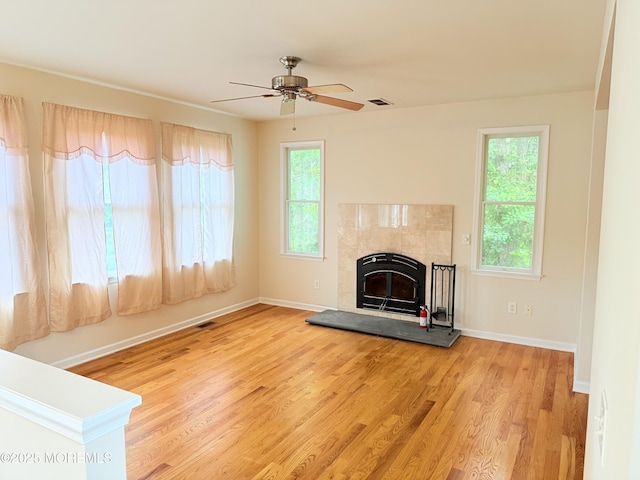 6 Eagle Ridge Ln, West Creek, NJ 08092 - unfurnished living room featuring wood finished floors, ceiling fan, and a tiled fireplace