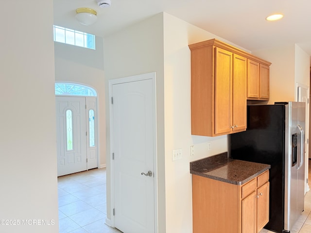 6 Eagle Ridge Ln, West Creek, NJ 08092 - kitchen with stainless steel fridge with ice dispenser, light tile patterned flooring, dark stone countertops, and recessed lighting