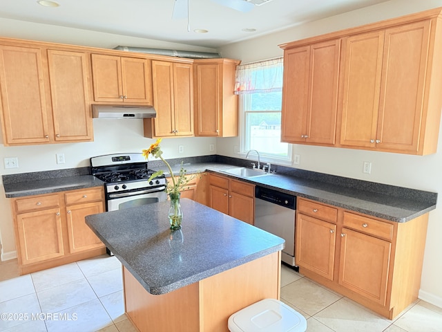 6 Eagle Ridge Ln, West Creek, NJ 08092 - kitchen with appliances with stainless steel finishes, under cabinet range hood, dark countertops, a kitchen island, and light tile patterned floors