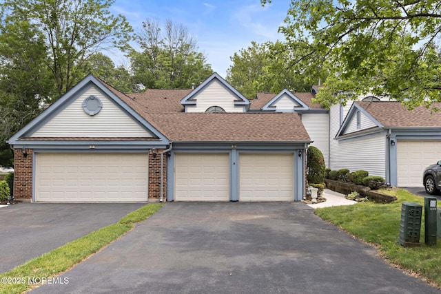 11 Old Orchard Ln, Ocean Twp, NJ 07712 - traditional-style home with a shingled roof, brick siding, and asphalt driveway