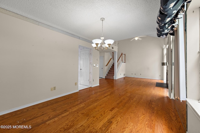 11 Old Orchard Ln, Ocean Twp, NJ 07712 - spare room with a chandelier, wood finished floors, a textured ceiling, a ceiling fan, and stairway