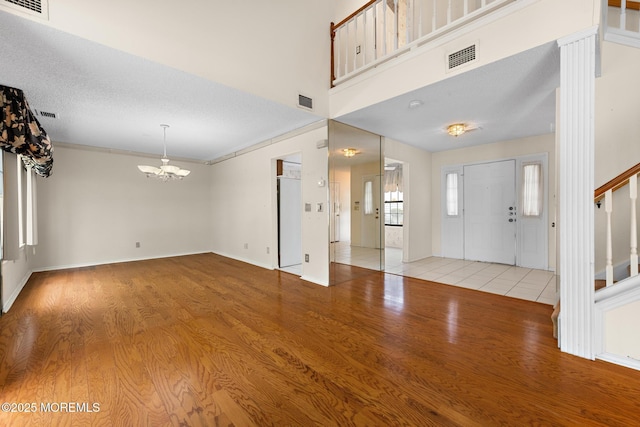11 Old Orchard Ln, Ocean Twp, NJ 07712 - foyer with a chandelier, light wood-style floors, and stairway