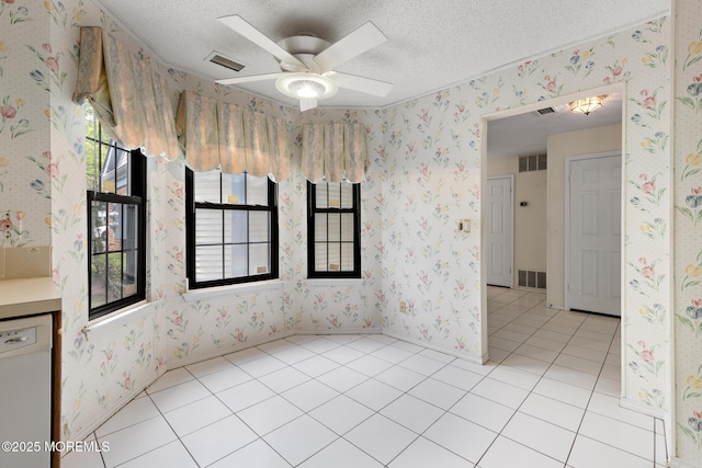 11 Old Orchard Ln, Ocean Twp, NJ 07712 - tiled spare room with a textured ceiling, wallpapered walls, and ceiling fan