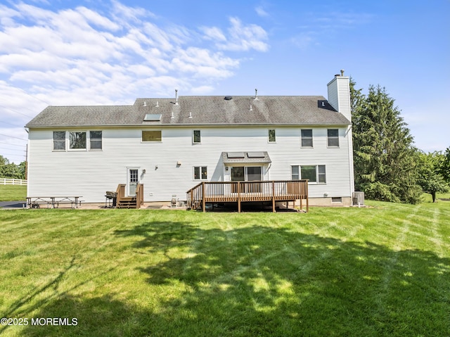 20 Birch Ln, Colts Neck, NJ 07722 - back of property featuring a wooden deck, a chimney, and a lawn