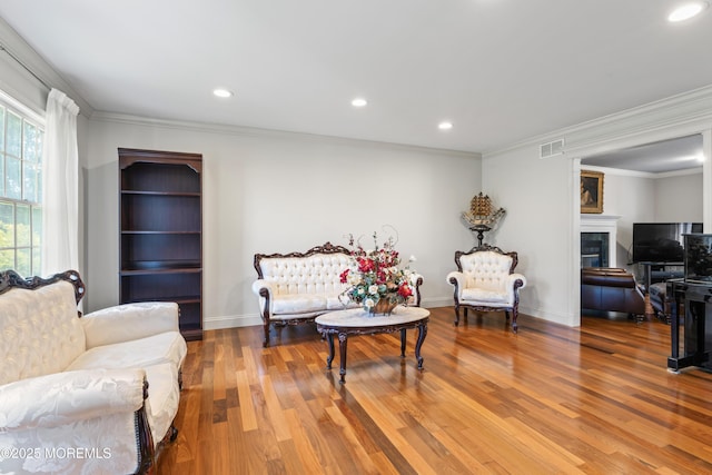 20 Birch Ln, Colts Neck, NJ 07722 - living room featuring a tiled fireplace, wood finished floors, ornamental molding, and recessed lighting