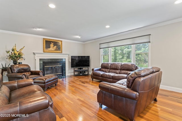 20 Birch Ln, Colts Neck, NJ 07722 - living room featuring light wood-style floors, ornamental molding, recessed lighting, and a high end fireplace