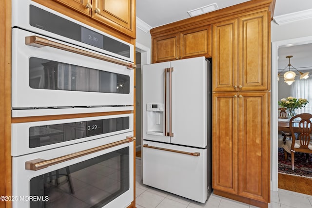 20 Birch Ln, Colts Neck, NJ 07722 - kitchen with white appliances, light tile patterned flooring, ornamental molding, and brown cabinets