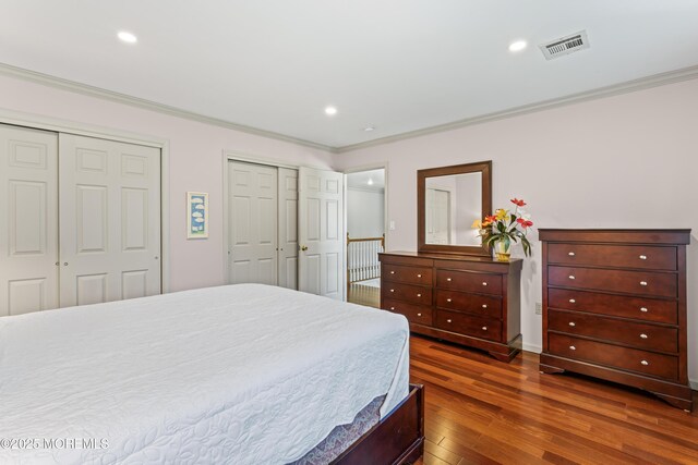 20 Birch Ln, Colts Neck, NJ 07722 - bedroom featuring multiple closets, dark wood-style flooring, ornamental molding, and recessed lighting