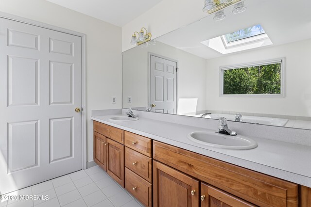 20 Birch Ln, Colts Neck, NJ 07722 - full bathroom featuring a skylight, double vanity, and tile patterned flooring