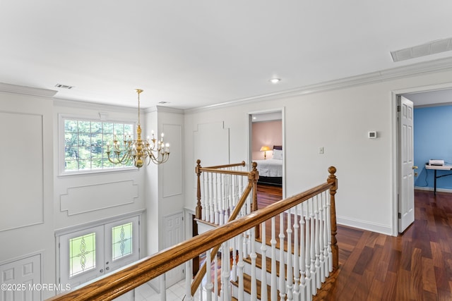 20 Birch Ln, Colts Neck, NJ 07722 - hallway with an upstairs landing, a chandelier, ornamental molding, and wood finished floors