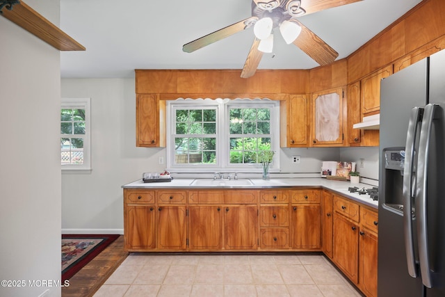 3 Mcelwaine Dr, Freehold, NJ 07728 - kitchen with stainless steel refrigerator with ice dispenser, under cabinet range hood, brown cabinets, ceiling fan, and light countertops