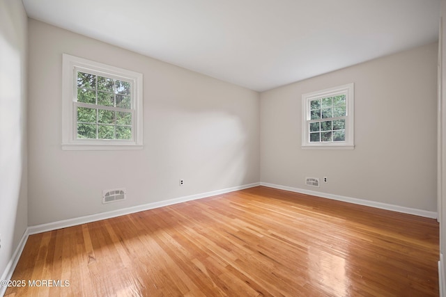 3 Mcelwaine Dr, Freehold, NJ 07728 - unfurnished room with healthy amount of natural light and light wood finished floors
