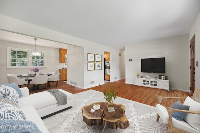 3 Mcelwaine Dr, Freehold, NJ 07728 - living area featuring wood finished floors and baseboards