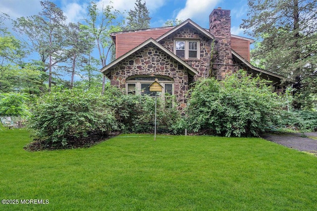 26 W Veterans Hwy, Jackson, NJ 08527 - view of front of house with stone siding, a front lawn, and a chimney