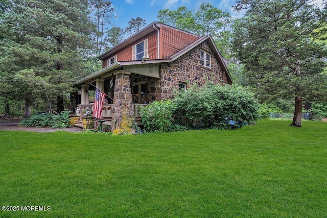 26 W Veterans Hwy, Jackson, NJ 08527 - view of front of home featuring stone siding, a front yard, and covered porch