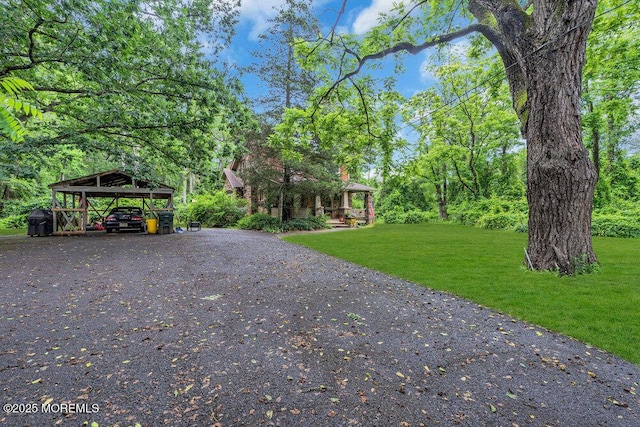 26 W Veterans Hwy, Jackson, NJ 08527 - view of front of home with a front yard, a detached carport, and driveway