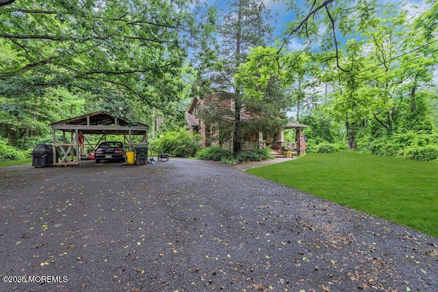 26 W Veterans Hwy, Jackson, NJ 08527 - view of grassy yard featuring driveway and a carport