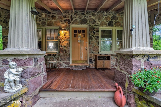 26 W Veterans Hwy, Jackson, NJ 08527 - doorway to property featuring stone siding and covered porch