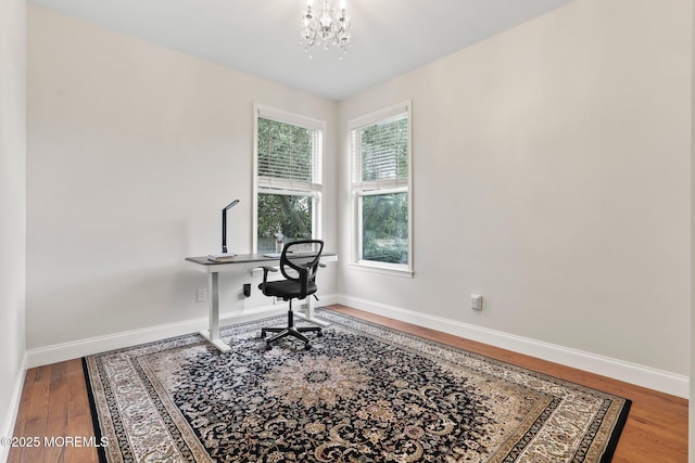 43 Shawnee Way, Morganville, NJ 07751 - office area featuring a chandelier and wood finished floors