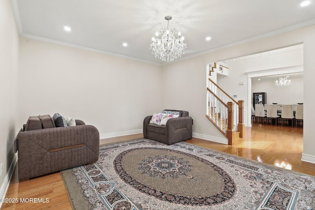 43 Shawnee Way, Morganville, NJ 07751 - living area with a chandelier, stairs, wood finished floors, recessed lighting, and ornamental molding