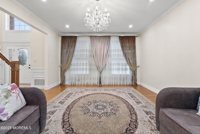 43 Shawnee Way, Morganville, NJ 07751 - living area with wood finished floors, a chandelier, ornamental molding, recessed lighting, and stairs