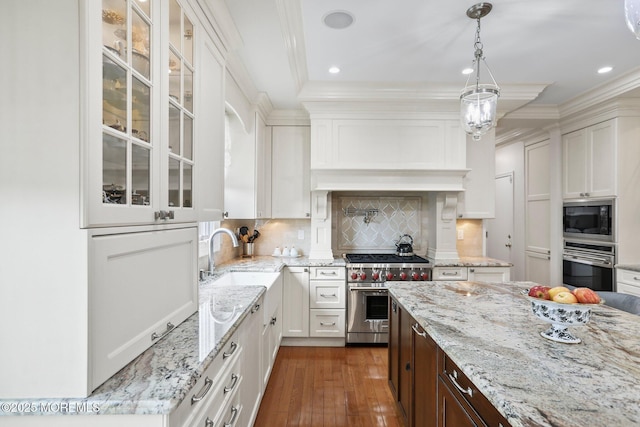 43 Shawnee Way, Morganville, NJ 07751 - kitchen with stainless steel appliances, white cabinetry, glass insert cabinets, ornamental molding, and recessed lighting