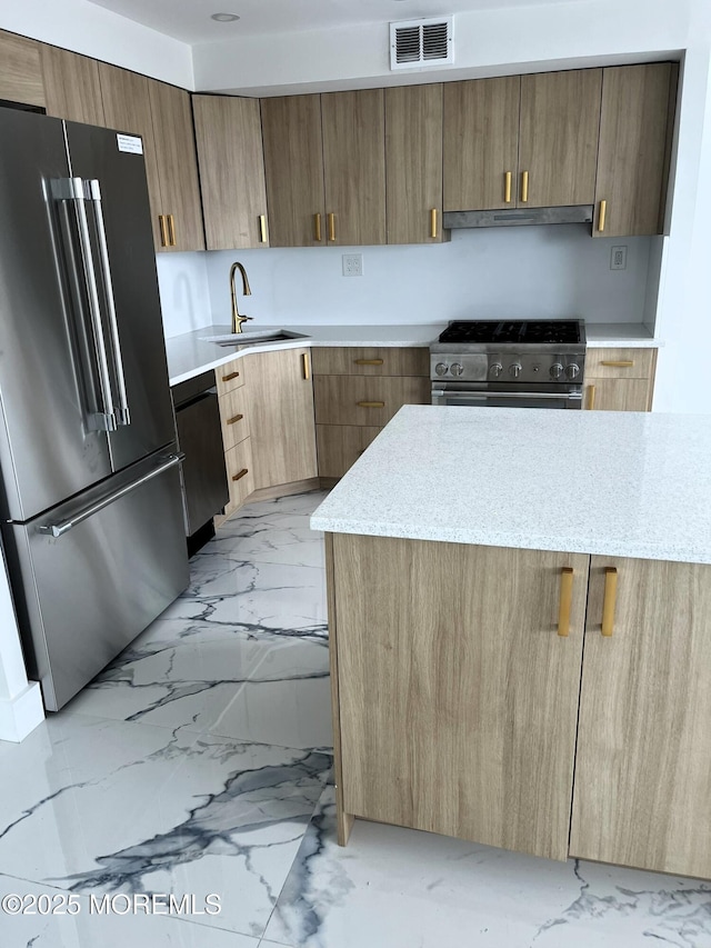 675 Ocean Ave # 9F, Long Branch, NJ 07740 - kitchen featuring high quality appliances, light marble finish floors, ventilation hood, modern cabinets, and light stone counters