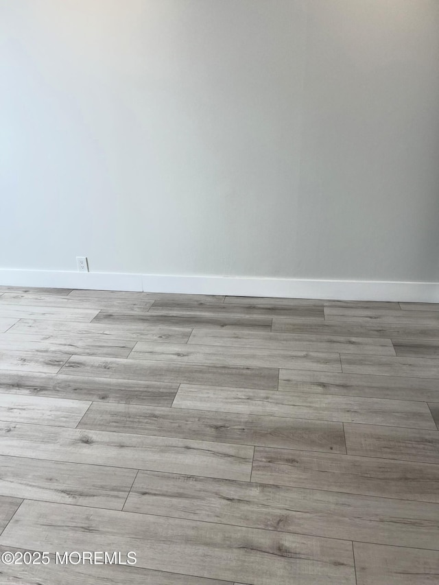 675 Ocean Ave # 9F, Long Branch, NJ 07740 - detailed view of baseboards and wood finished floors