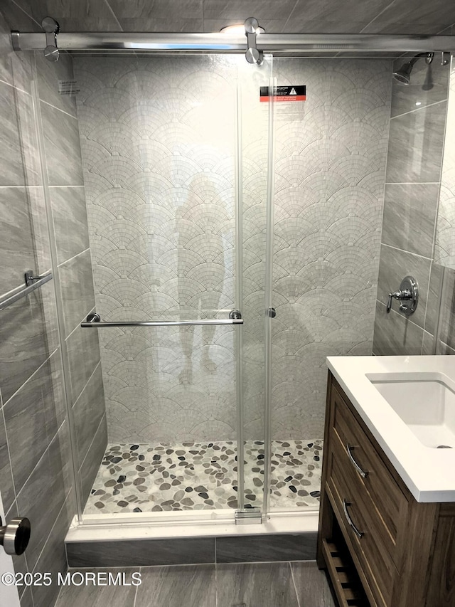 675 Ocean Ave # 9F, Long Branch, NJ 07740 - bathroom featuring a shower stall and vanity
