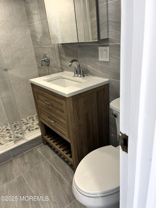 675 Ocean Ave # 9F, Long Branch, NJ 07740 - full bath with tile walls, vanity, tile patterned floors, and a walk in shower
