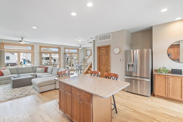 85 Channel Dr, Brick, NJ 08723 - kitchen featuring stainless steel refrigerator with ice dispenser, ceiling fan, a breakfast bar area, light wood finished floors, and recessed lighting