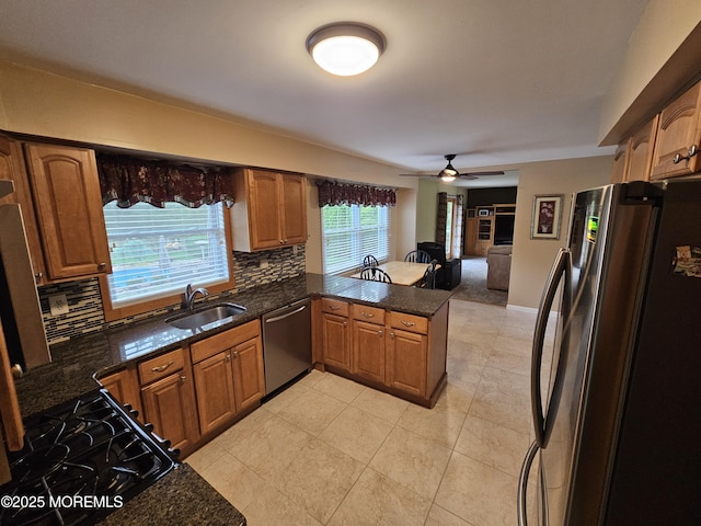 217 Betsy Ross Dr, Freehold, NJ 07728 - kitchen with appliances with stainless steel finishes, a peninsula, backsplash, and ceiling fan