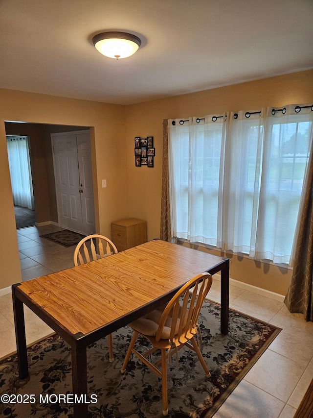 217 Betsy Ross Dr, Freehold, NJ 07728 - dining area featuring light tile patterned floors and baseboards