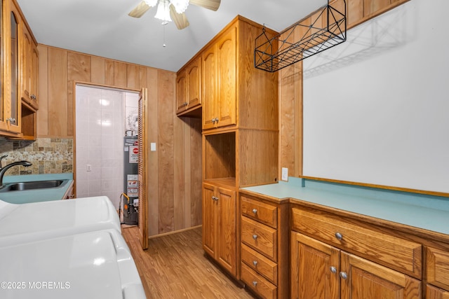 30 N Maplewood Dr, Brick, NJ 08723 - laundry room with independent washer and dryer, cabinet space, a ceiling fan, light wood-type flooring, and water heater