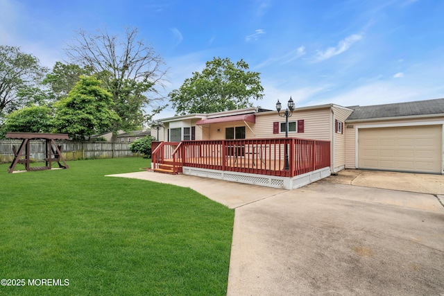 30 N Maplewood Dr, Brick, NJ 08723 - view of front of home featuring concrete driveway, a wooden deck, an attached garage, and a playground