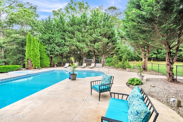 15 Conor Rd, Jackson, NJ 08527 - view of swimming pool featuring a patio area, an in-ground hot tub, and view of wooded area