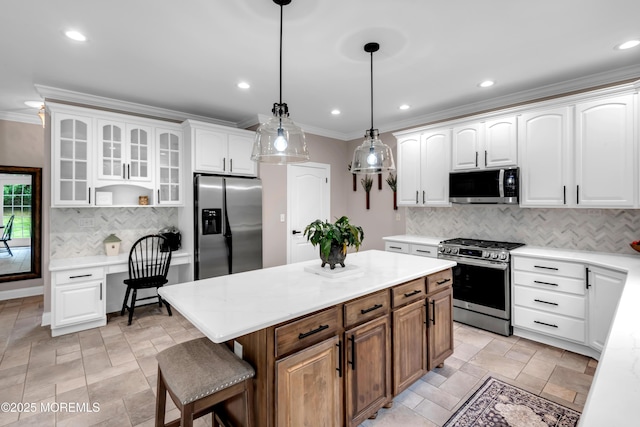 15 Conor Rd, Jackson, NJ 08527 - kitchen with stainless steel appliances, crown molding, white cabinetry, glass insert cabinets, and light countertops