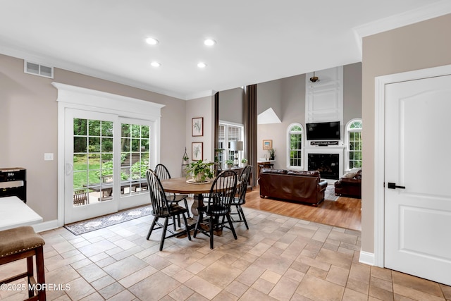 15 Conor Rd, Jackson, NJ 08527 - dining room featuring recessed lighting, light stone finish floors, a large fireplace, and crown molding