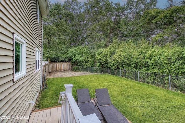 15 Liverpool Ct, Toms River, NJ 08753 - fenced backyard featuring view of wooded area and a deck