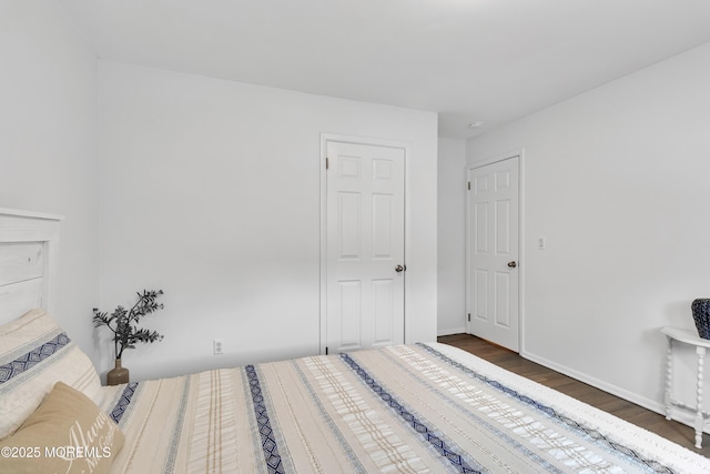 15 Liverpool Ct, Toms River, NJ 08753 - unfurnished bedroom with dark wood-style flooring and baseboards