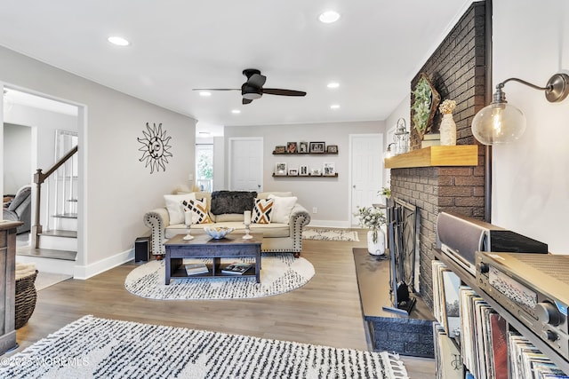 15 Liverpool Ct, Toms River, NJ 08753 - living room featuring a ceiling fan, wood finished floors, stairs, a brick fireplace, and recessed lighting