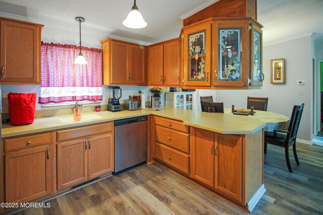26 Pine Ridge Blvd, Whiting, NJ 08759 - kitchen with stainless steel dishwasher, ornamental molding, a peninsula, light countertops, and dark wood-style flooring