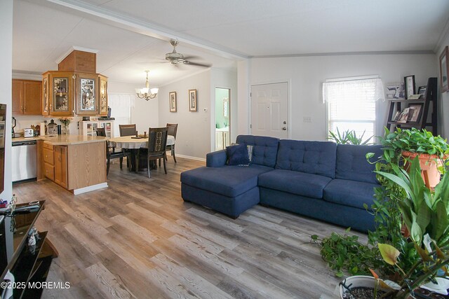 26 Pine Ridge Blvd, Whiting, NJ 08759 - living room featuring light wood-style flooring, a chandelier, and ornamental molding