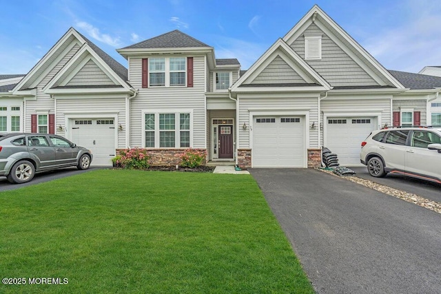 73 Aqueduct Blvd, New Egypt, NJ 08533 - view of property featuring driveway, a front lawn, stone siding, and a garage
